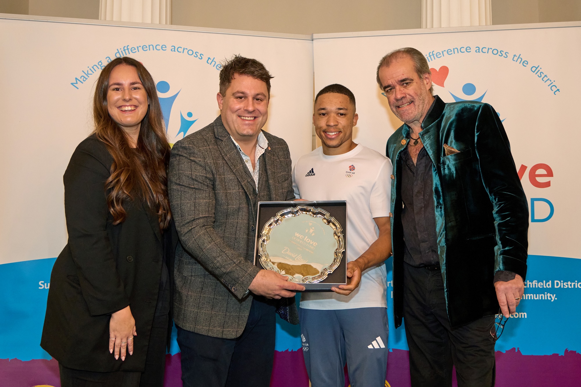 From left: Eden Glover and Andy Lightbown being presented with the We Love Lichfield Community Champion 2024 Award by artistic gymnast Joe Fraser with patron Simon Price.