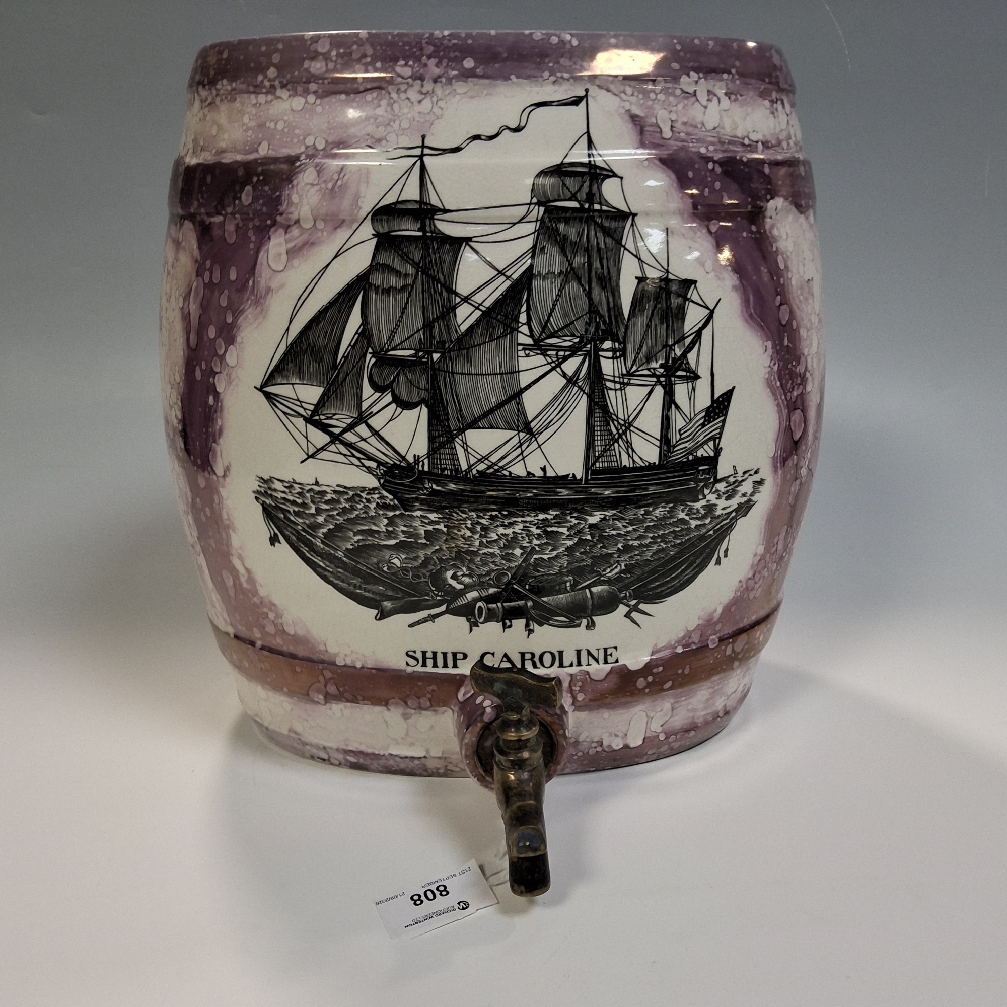 Lot 808: A Portmeirion Gray's Sunderland Pink Lustre spirit barrel with a tansfer print of 'Ship Caroline'.