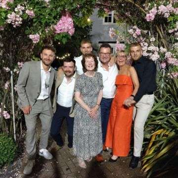 Tom Ben James Richard Jan and Harry Winterton with Sue French 50 years July 2024 web.jpg