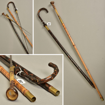 Lot 257: Two antique sword sticks.