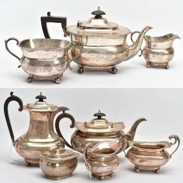 An early C20th three-piece silver tea set (top) and a silver five-piece tea set to include teapot and hot water jug, each with a wooden scroll handle. Lot 73 (top) and Lot 83.