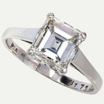 Lot 3: An emerald cut single stone diamond ring.