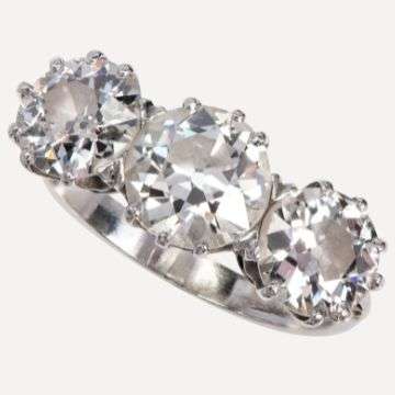 Lot 2: A large three stone diamond ring.