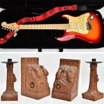 Featuring in the sale are this USA-made 2004 Fender Stratocaster Deluxe and Robert ‘Mouseman’ Thompson bookends and candlesticks.