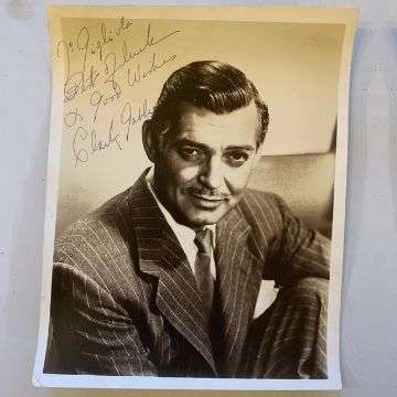 A rare personalised signed photograph of Clark Gable.