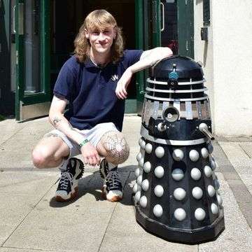 Tamworth saleroom porter Reece Lawlor gets acquainted with a Dalek!