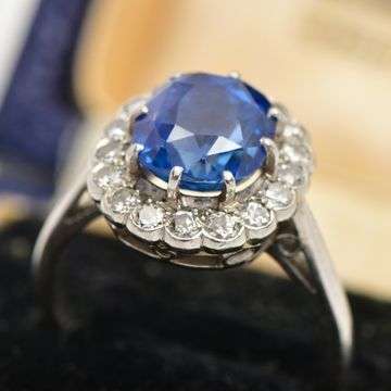 Lot 6 is an early 20th century unheated certified 4.16ct Burmese sapphire and diamond ring.