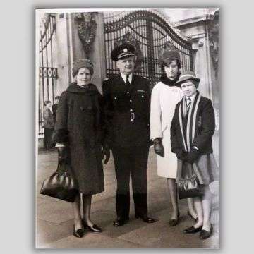 George Goodman received the MBE the same day as The Beatles. He is pictured in uniform outside Buckingham Palace with wife Doris and daughters Jill and Joy (in school uniform).