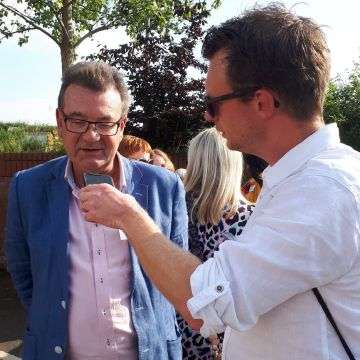 Auctioneer Richard Winterton being interviewed by BBC Radio WM at the launch event at St Giles Hospice.