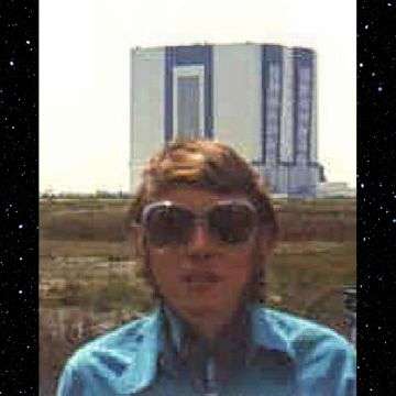 Phill in front of NASA VAB rocket, Florida assembly building, awaiting the launch of Saturn V.