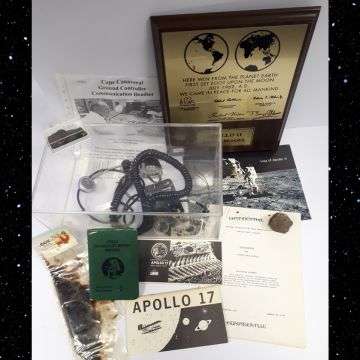 Part of the collection including the Cape Canaveral communication headset as used by ground control during Project Mercury and Project Gemini and the mounted replica of the Apollo 11 lunar plaque signed by Buzz Aldrin.